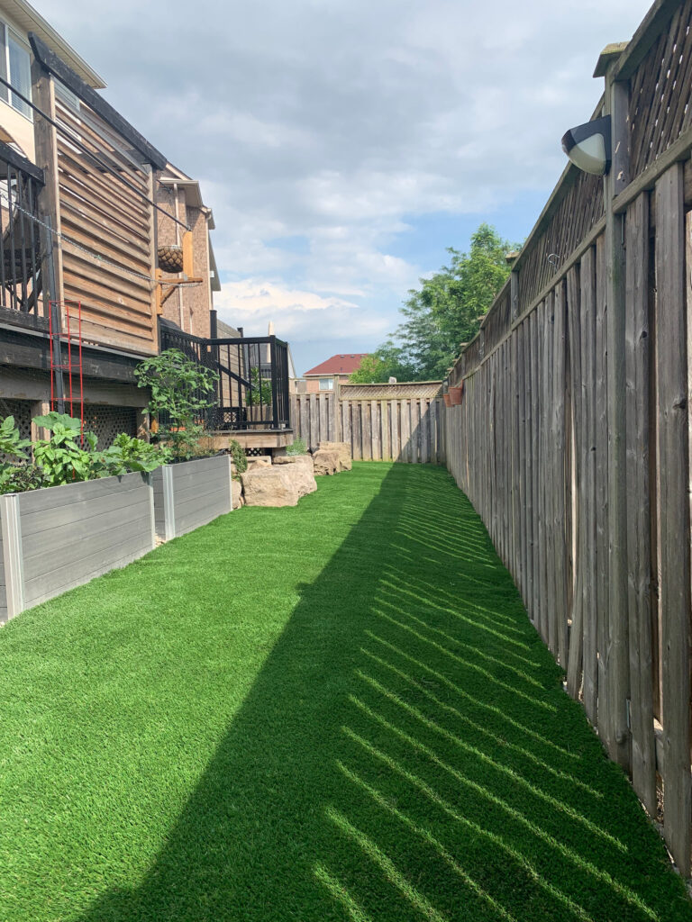 A long run of turf along a fence line