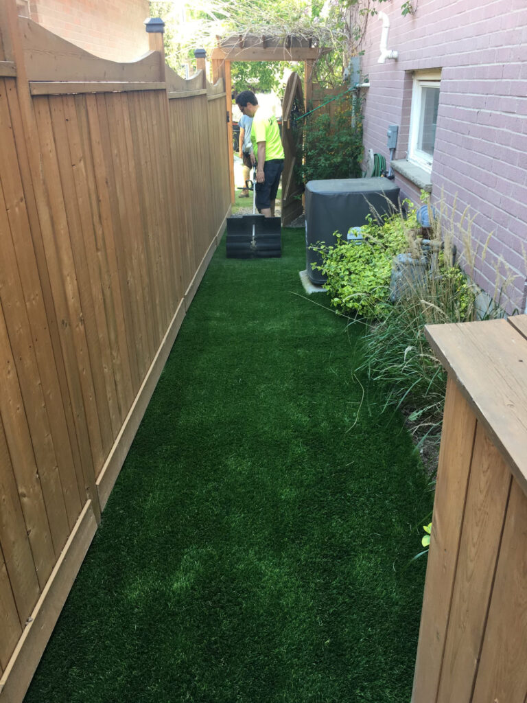 Artificial turf laid down a narrow side yard