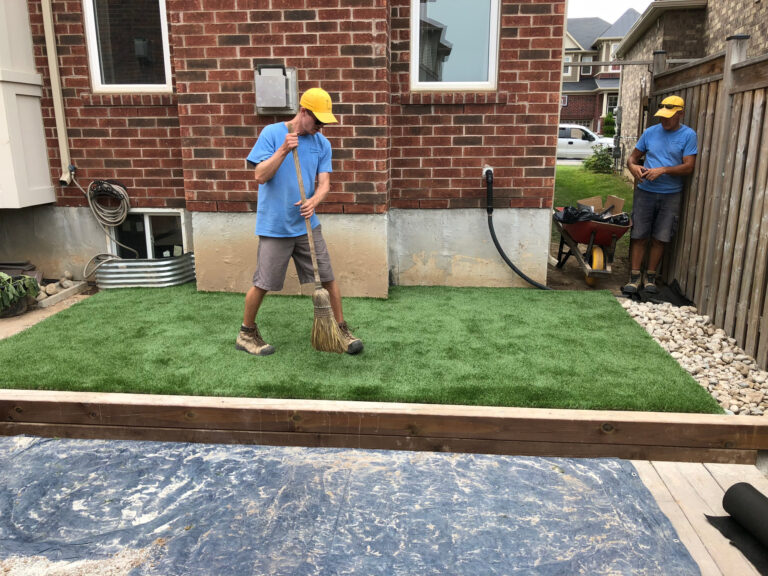 The crew installing artificial turf